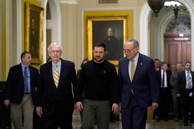 Ukrainian President Volodymyr Zelenskyy arrives at the U.S. Capitol with Senate Minority Leader Mitch McConnell, R-Ky., left, and Senate Majority Leader Chuck Schumer, D-N.Y., on Dec. 12, 2023.